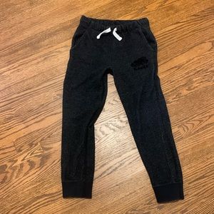Brand new youth small black roots pants